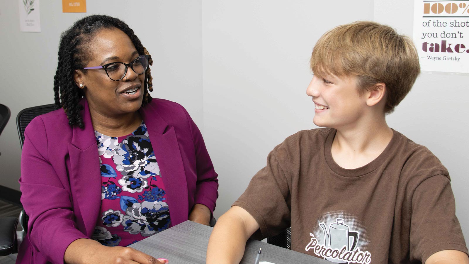 teacher helping teen with work