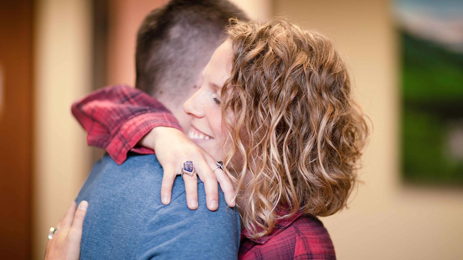 two people sharing a hug.