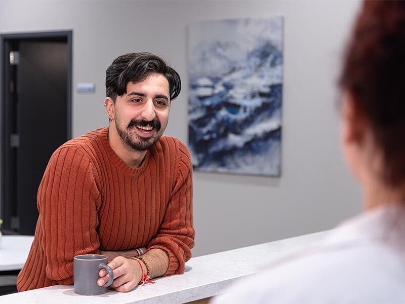 Young Adult Man At Front Desk