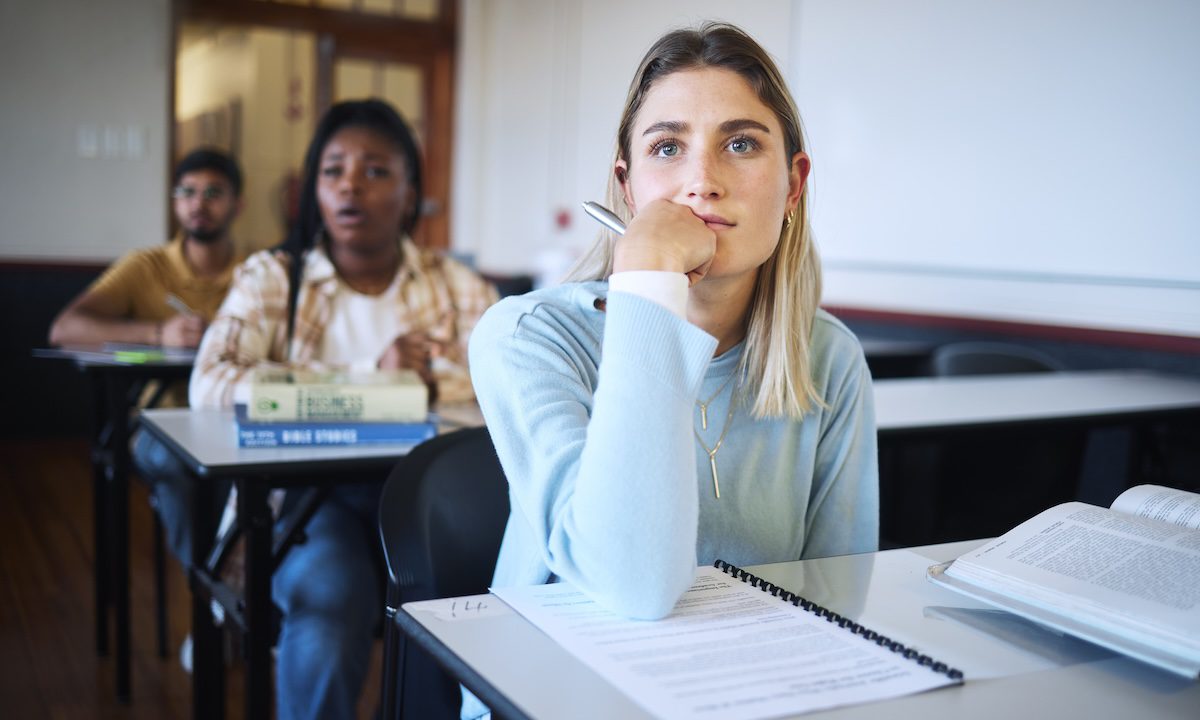 University, education class and lecture listening with a girl student ready to take notes for exam