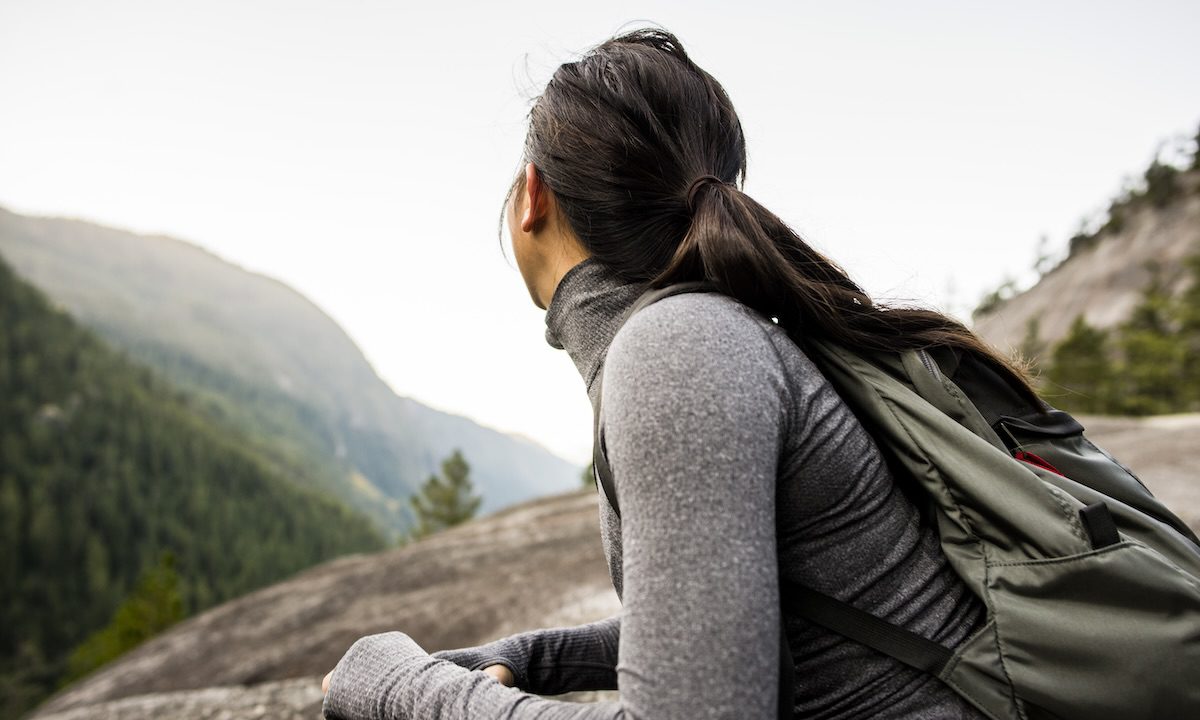 Young woman looking at view, Squamish, British Columbia, Canada