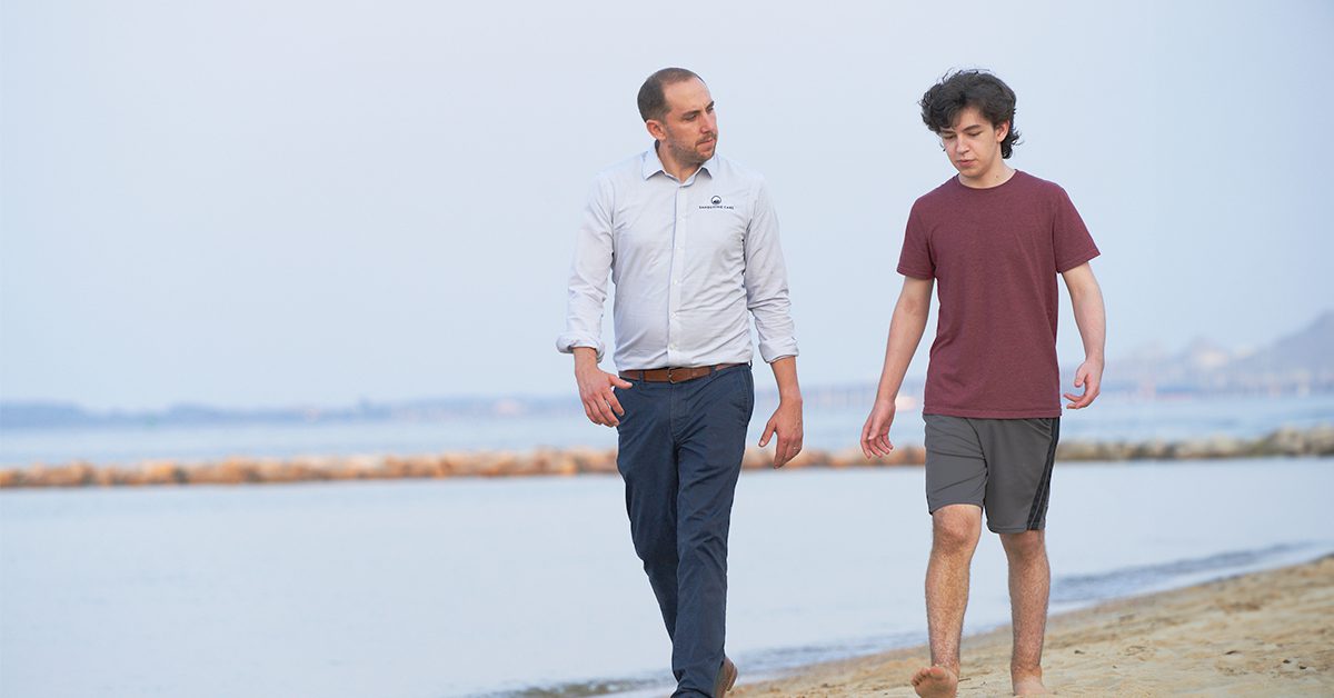 Parent and teen walking